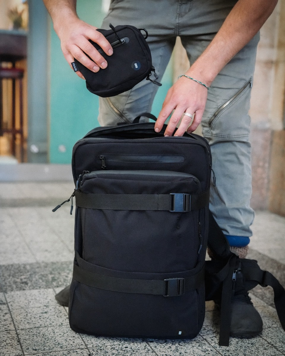 NQ1 Modular Backpack 35 Liter configuration at the train station as a travel backpack
